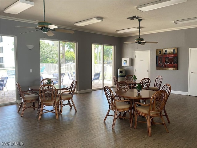 14831 Park Lake Dr Unit 309, Fort Myers, FL 33919 - dining area featuring crown molding, visible vents, a ceiling fan, and dark wood-style floors