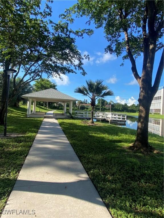 14831 Park Lake Dr Unit 309, Fort Myers, FL 33919 - surrounding community featuring a gazebo, a water view, and a yard