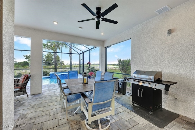 view of patio / terrace with visible vents, a pool with connected hot tub, ceiling fan, glass enclosure, and a grill