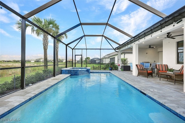 view of pool featuring a ceiling fan, an outdoor living space, a pool with connected hot tub, a lanai, and a patio area