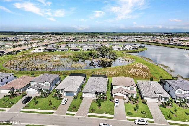 bird's eye view with a residential view and a water view