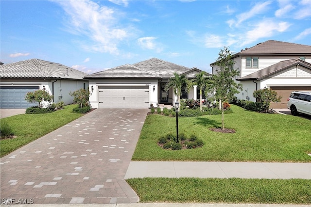 view of front of property with a garage and a front yard