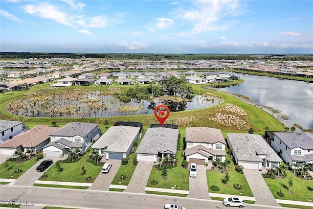 bird's eye view with a water view