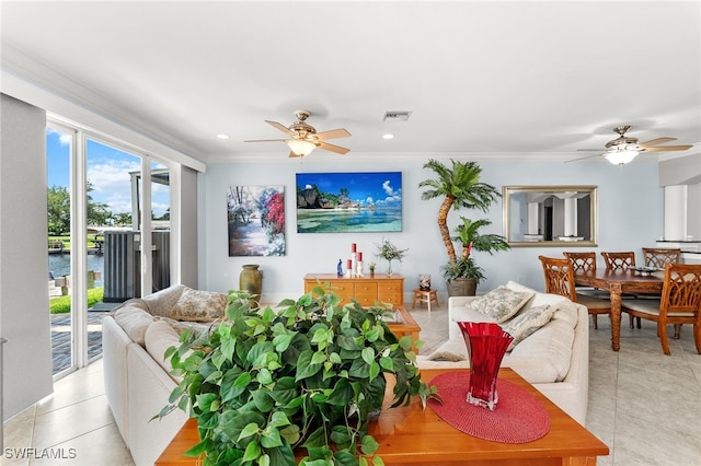 living room with ceiling fan, light tile patterned floors, and ornamental molding