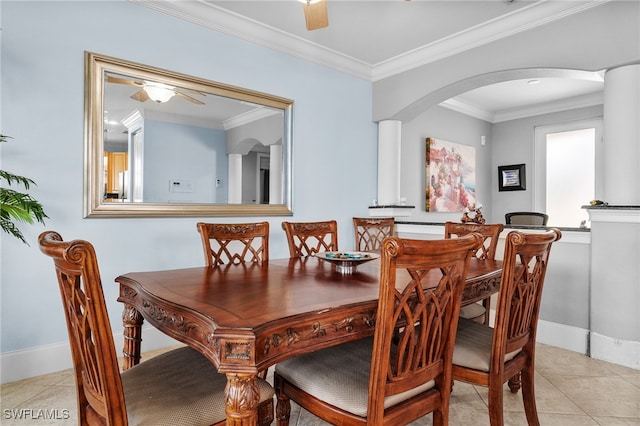 dining area with ceiling fan, light tile patterned flooring, and crown molding