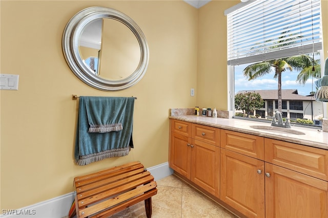 bathroom featuring tile patterned flooring and vanity