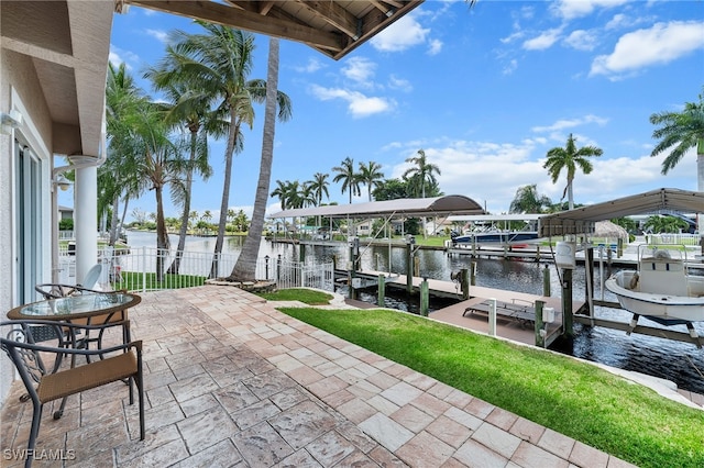 view of patio featuring a water view and a boat dock