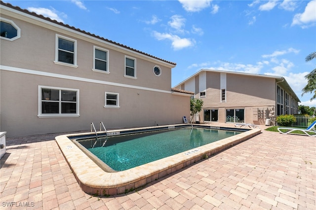 view of swimming pool featuring a patio