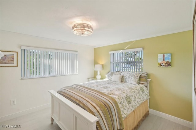 bedroom featuring crown molding