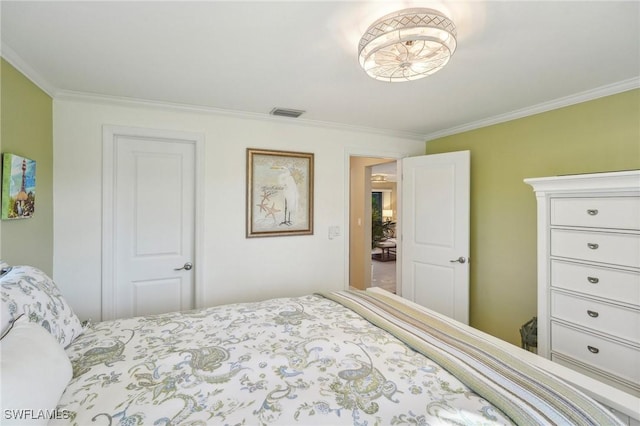 bedroom with crown molding