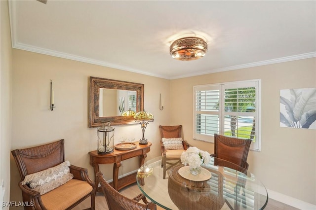 sitting room with hardwood / wood-style flooring and ornamental molding