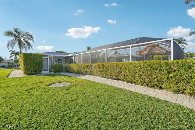 view of yard featuring glass enclosure