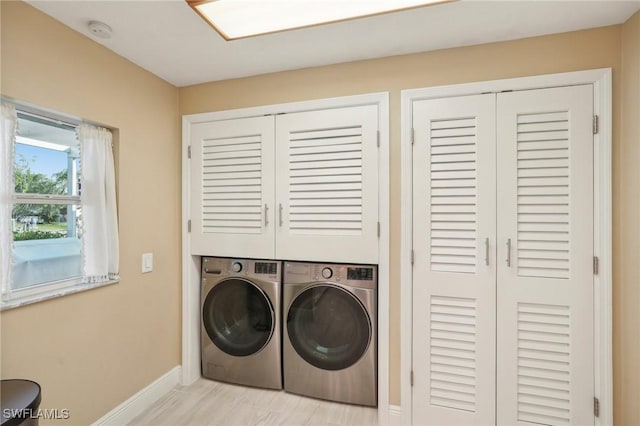 washroom with washer and dryer