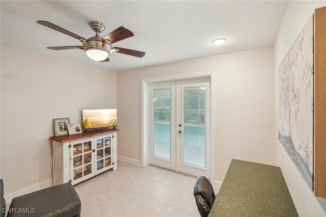 interior space with french doors and ceiling fan