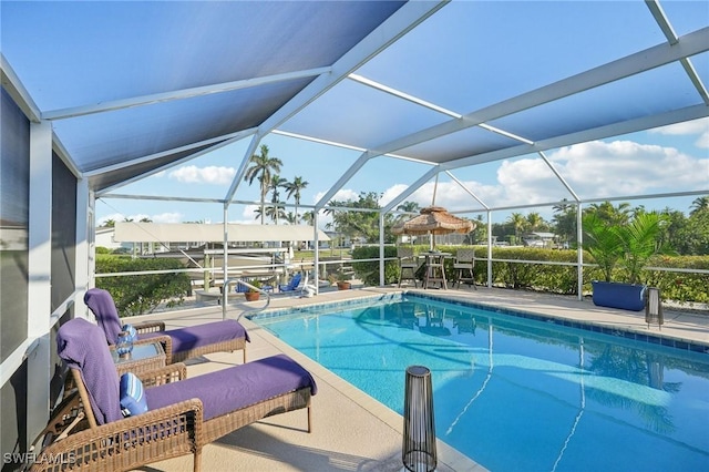 view of pool with a lanai and a patio