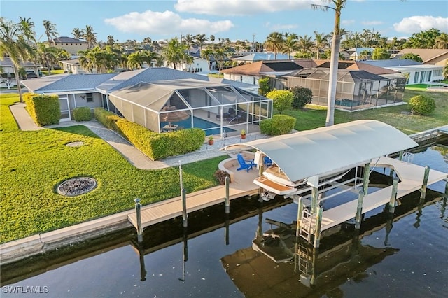 view of dock featuring a water view, a yard, and glass enclosure