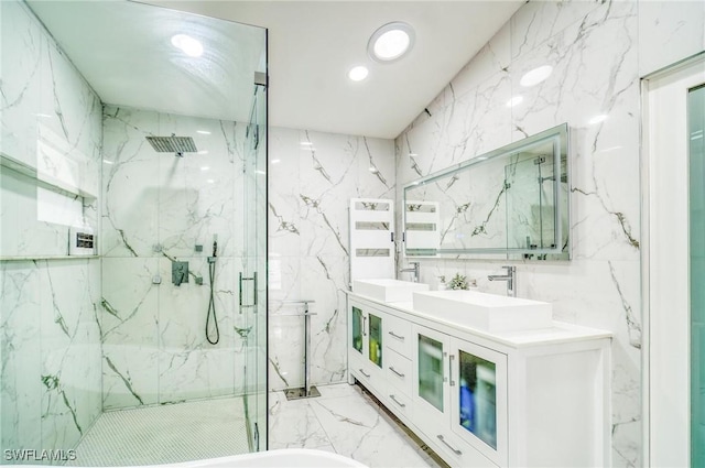 bathroom featuring vanity, walk in shower, and tile walls