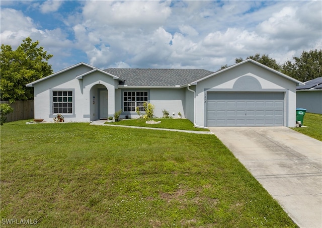 ranch-style house with a garage and a front yard