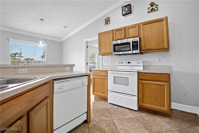 kitchen featuring white appliances, light tile patterned flooring, decorative light fixtures, and a healthy amount of sunlight