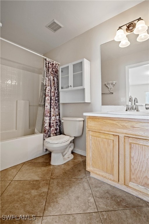 full bathroom with tile patterned flooring, shower / bath combination with curtain, toilet, and vanity