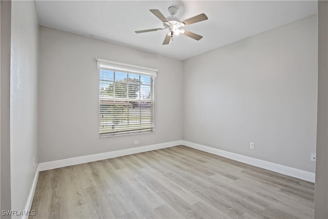 empty room with light wood-type flooring and ceiling fan