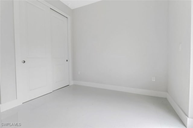 unfurnished bedroom with a closet