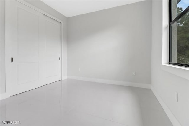 unfurnished bedroom with a closet