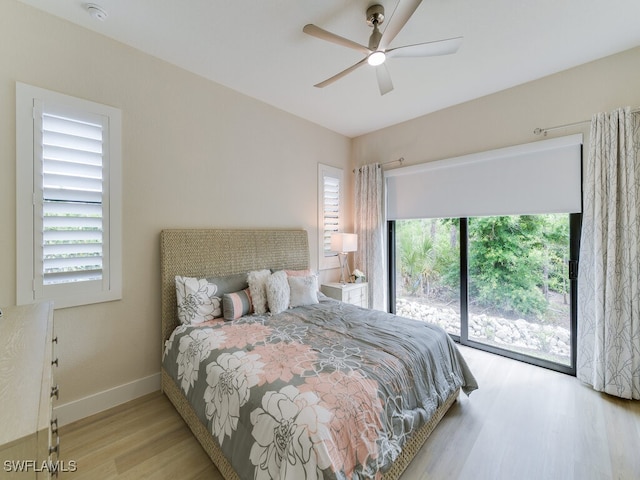 bedroom with ceiling fan, light wood-type flooring, access to outside, and multiple windows