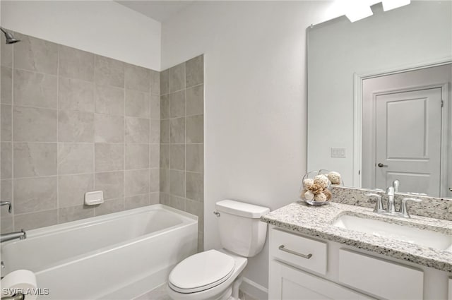 full bathroom featuring tiled shower / bath, vanity, and toilet