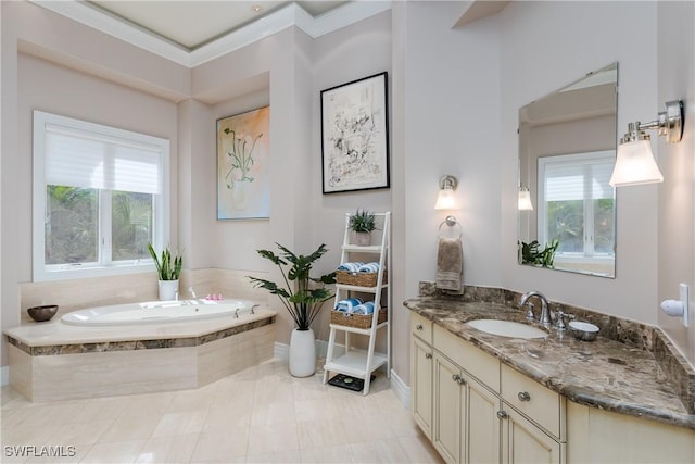 bathroom featuring a garden tub, crown molding, and vanity