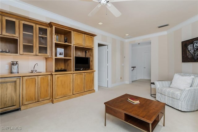 living room with light carpet, wallpapered walls, baseboards, visible vents, and crown molding