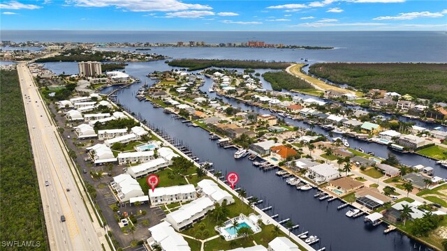 birds eye view of property featuring a water view