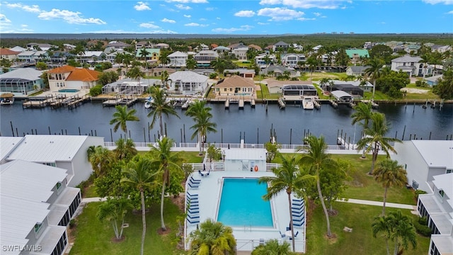 bird's eye view featuring a residential view and a water view