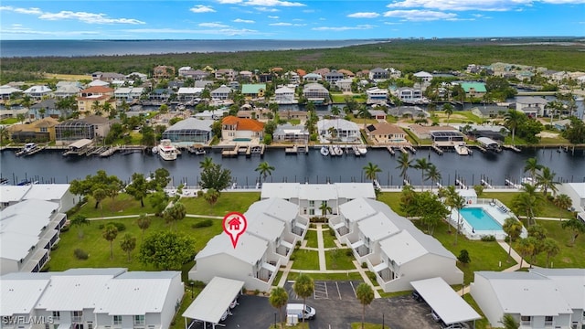 aerial view featuring a water view and a residential view