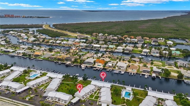 bird's eye view featuring a residential view and a water view