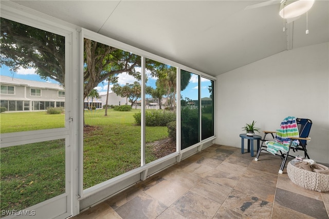 sunroom / solarium with ceiling fan