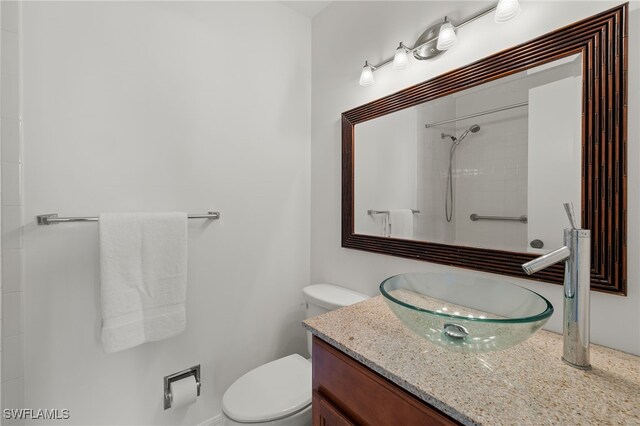 bathroom featuring toilet and vanity