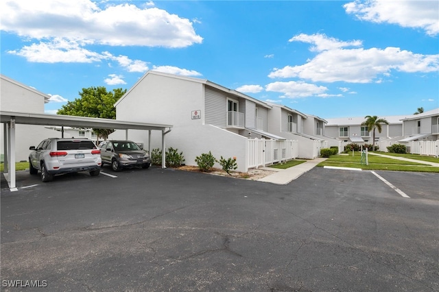 partially covered parking lot with a residential view