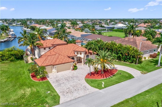 bird's eye view featuring a water view and a residential view