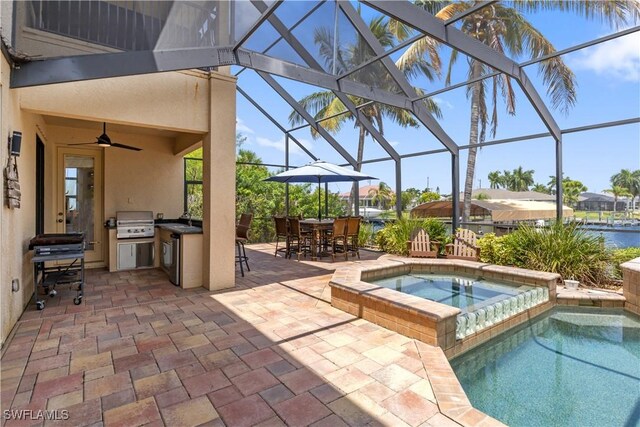 view of swimming pool featuring glass enclosure, a patio, an in ground hot tub, a grill, and ceiling fan