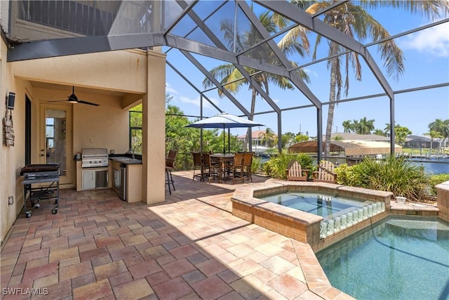 pool featuring area for grilling, a patio area, glass enclosure, a grill, and an in ground hot tub