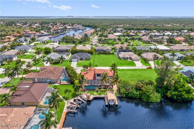 birds eye view of property featuring a water view