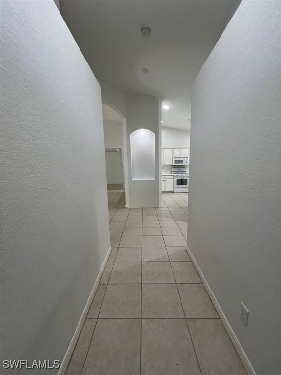 hallway with light tile patterned floors