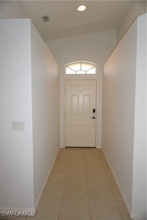 doorway to outside featuring light tile patterned floors