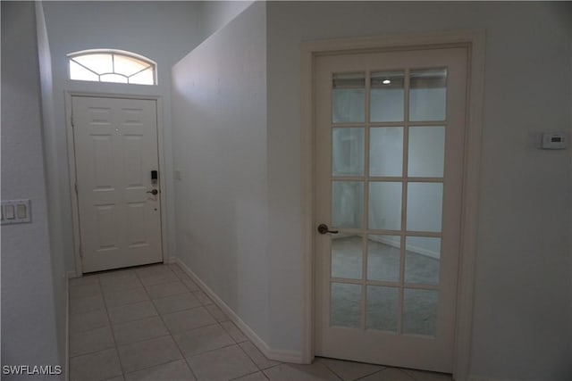 doorway featuring light tile patterned floors