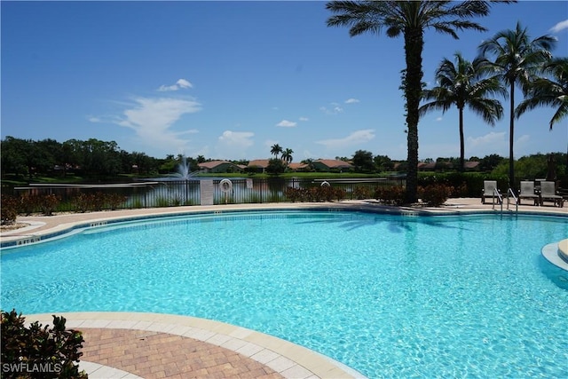 view of pool with a water view