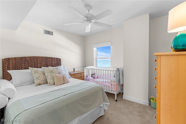 carpeted bedroom featuring ceiling fan