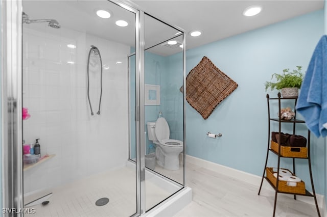 bathroom with toilet and walk in shower