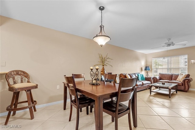 4965 Sandra Bay Dr Unit 103, Naples, FL 34109 - dining room featuring ceiling fan, light tile patterned floors, and baseboards