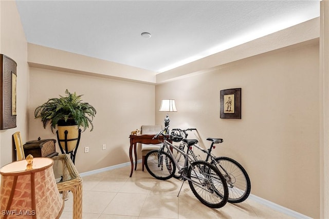 4965 Sandra Bay Dr Unit 103, Naples, FL 34109 - dining area with baseboards and light tile patterned flooring